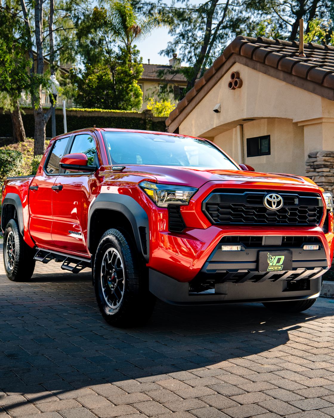 Signature Full Detail — red Toyota Tacoma